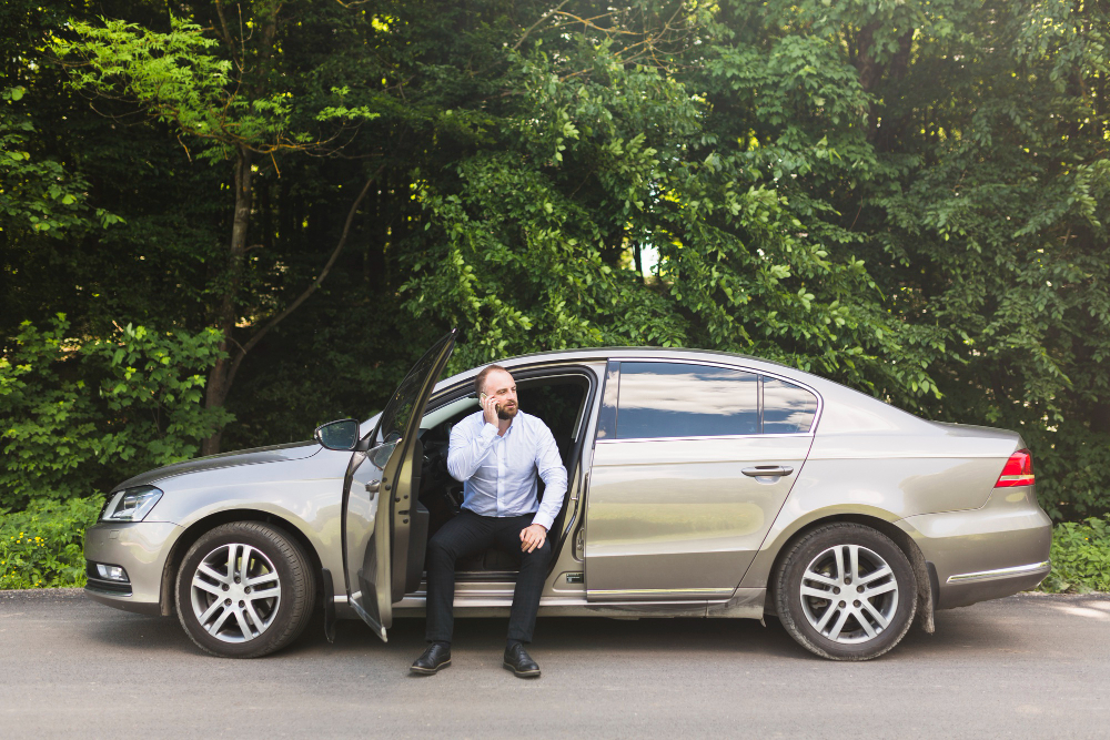 Happy family loading luggage into rental SUV for vacation